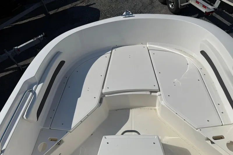 Slide: The Image of 2026 Bayliner Trophy T20CC boat deck with seating and storage compartments. - 12