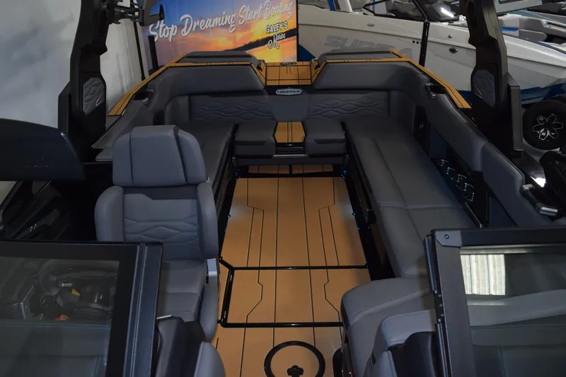 Slide: The Image of Interior of 2026 Supra SL 550 boat with luxurious seating and sleek design. - 18