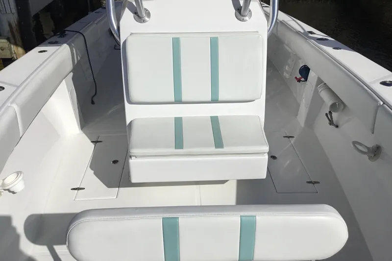 Slide: The Image of 2000 Jupiter 31 Center Console boat interior with white and teal seating. - 11
