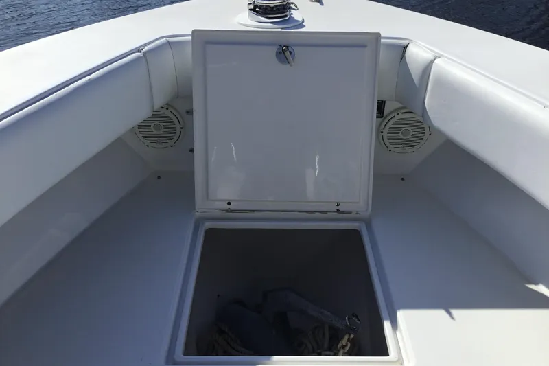 Slide: The Image of 2000 Jupiter 31 Center Console boat with open storage compartment and speakers. - 14