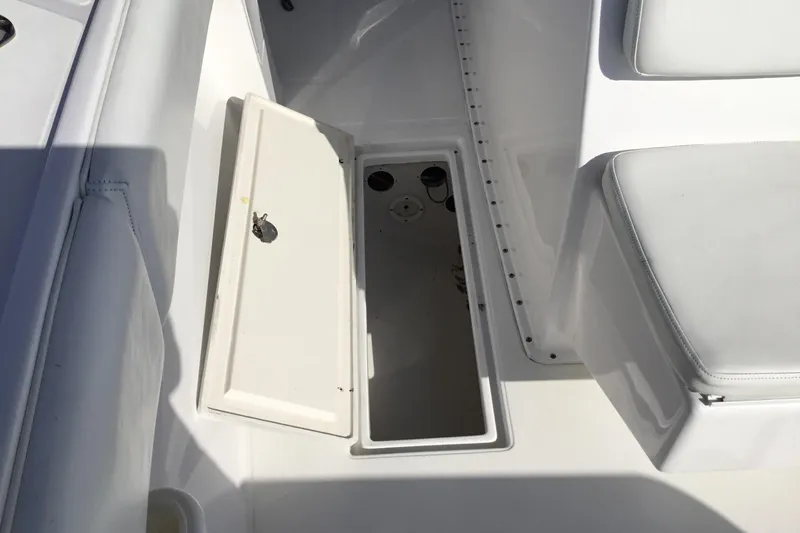 Slide: The Image of Open storage compartment on a 2000 Jupiter 31 Center Console boat deck. - 21