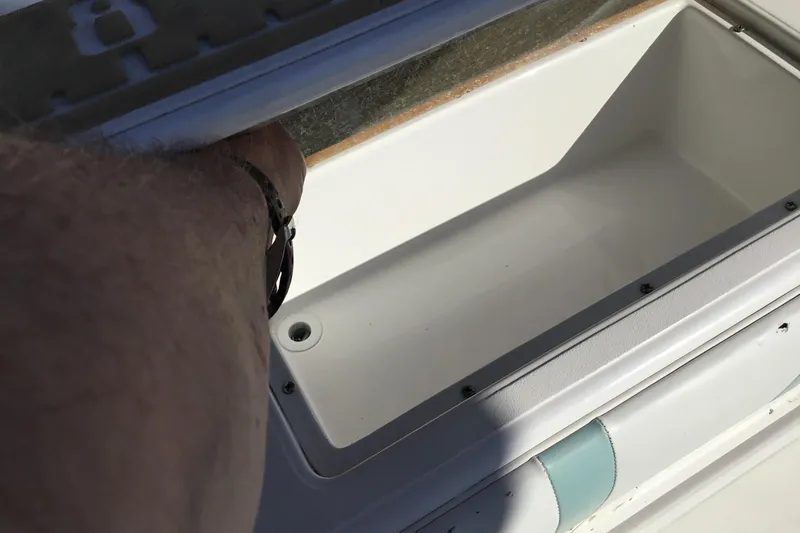 Slide: The Image of Open storage compartment on 2000 Jupiter 31 Center Console boat. - 37
