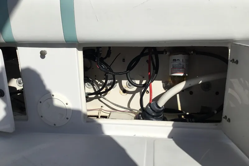 Slide: The Image of Open compartment of a 2000 Jupiter 31 Center Console boat showing wiring and components. - 41