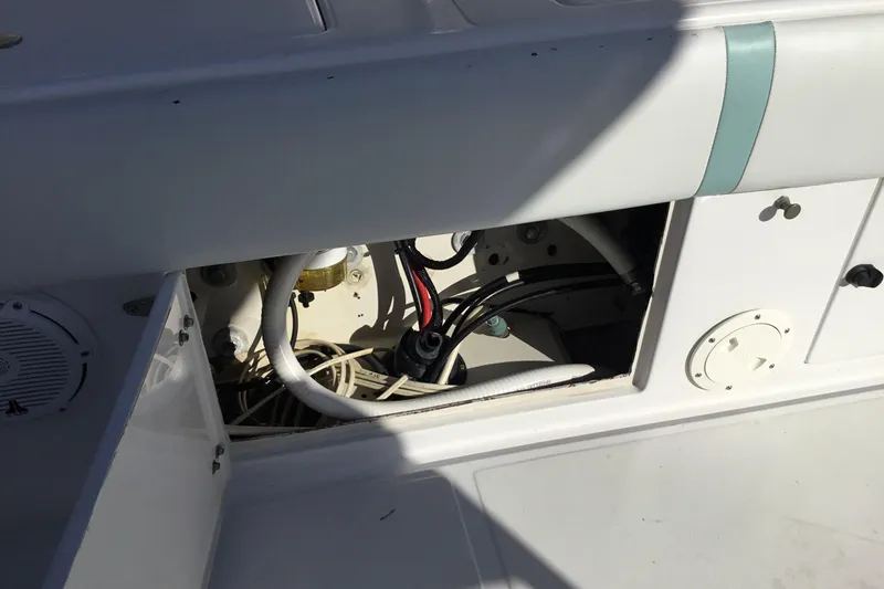 Slide: The Image of Open compartment on 2000 Jupiter 31 Center Console boat showing internal wiring and components. - 43