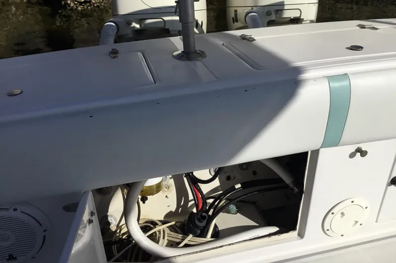 Slide: The Image of 2000 Jupiter 31 Center Console boat interior with visible wiring and components. - 44