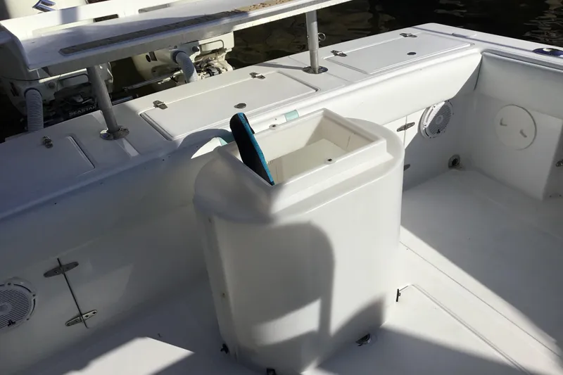 Slide: The Image of 2000 Jupiter 31 Center Console boat interior with storage compartments and seating. - 55