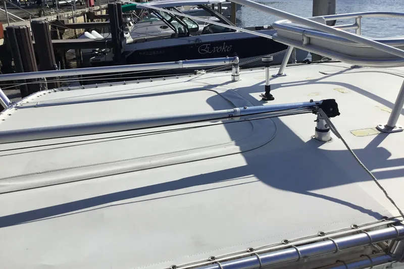 Slide: The Image of 2000 Jupiter 31 Center Console boat deck with stainless steel railings. - 58