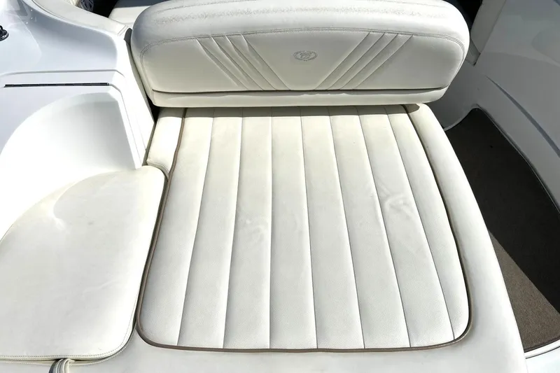 Slide: The Image of White leather seating on a 2007 Cobalt 232 boat, showcasing elegant design. - 21