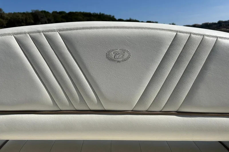 Slide: The Image of White leather seat with embossed logo on a 2007 Cobalt 232 boat. - 27