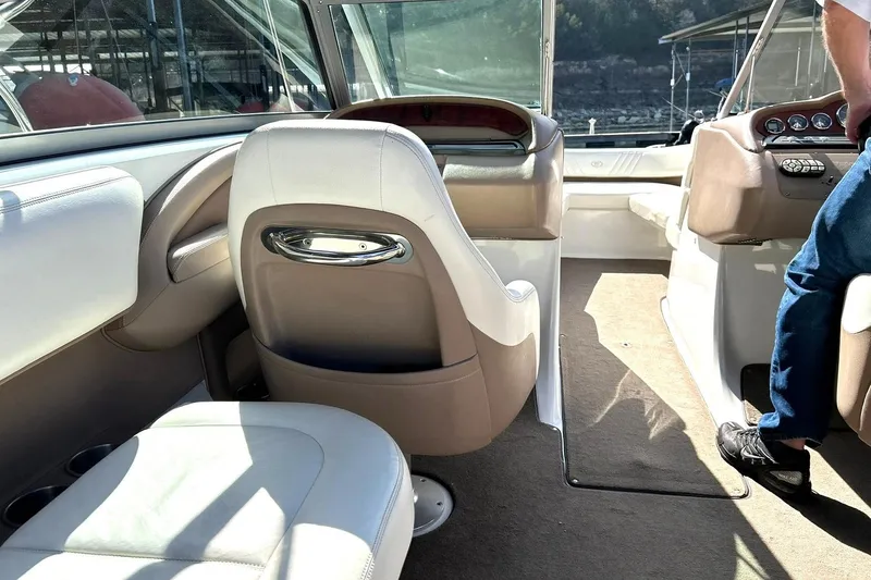 Slide: The Image of Interior of a 2007 Cobalt 232 boat with beige and white seating. - 28