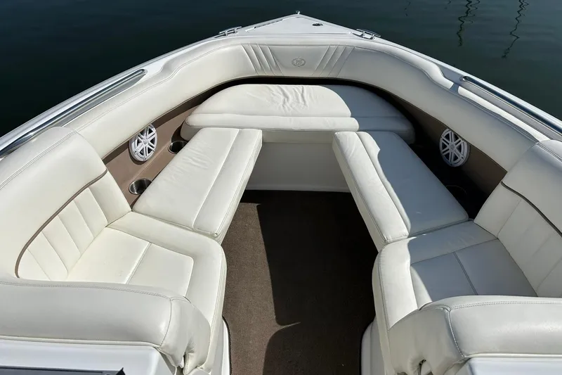 Slide: The Image of Interior of a 2007 Cobalt 232 boat with white leather seating. - 36