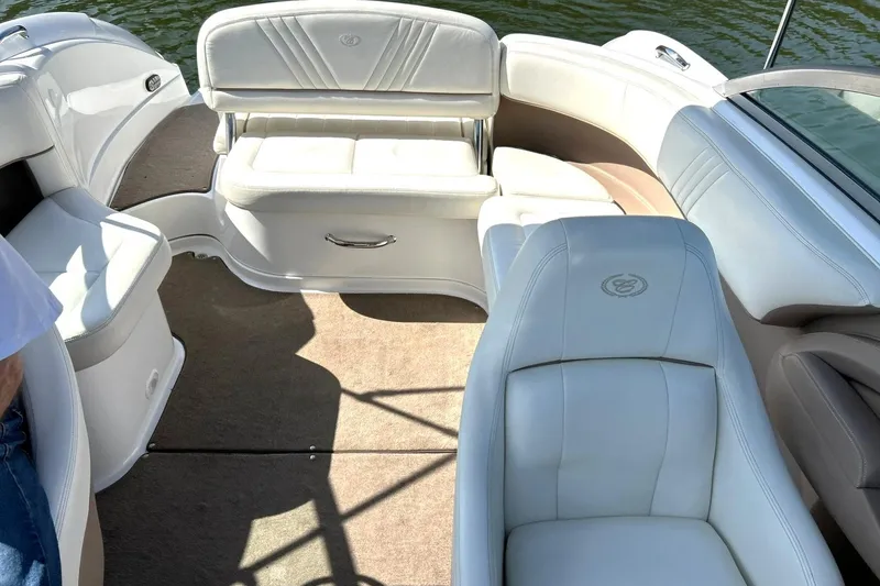 Slide: The Image of Interior of a 2007 Cobalt 232 boat with white leather seating. - 4
