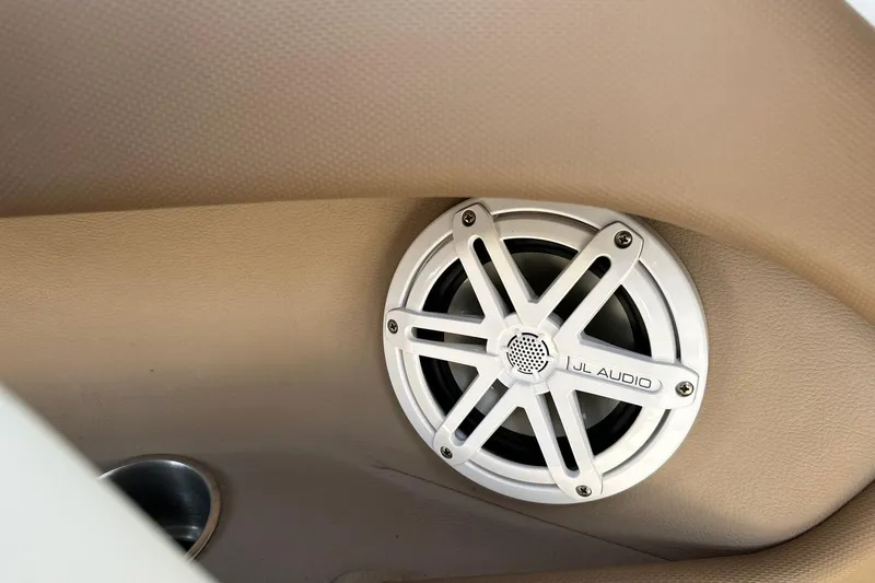 Slide: The Image of JL Audio speaker in 2007 Cobalt 232 boat interior, beige upholstery. - 46