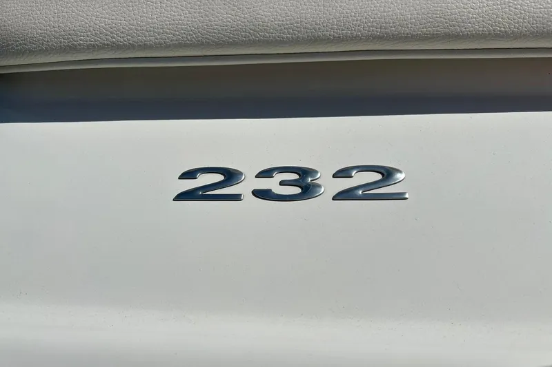 Slide: The Image of Close-up of 2007 Cobalt 232 model emblem on white surface. - 51