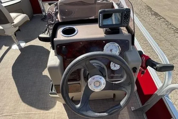 Slide: The Image of 2022 Sun Tracker Bass Buggy 18 DLX steering console with gauges and fish finder. - 14