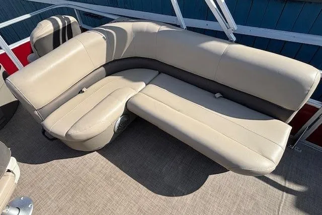 Slide: The Image of 2022 Sun Tracker Bass Buggy 18 DLX pontoon boat with beige seating and carpeted floor. - 15