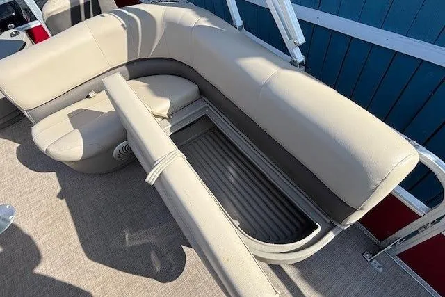 Slide: The Image of 2022 Sun Tracker Bass Buggy 18 DLX pontoon boat with beige seating and storage compartment. - 16