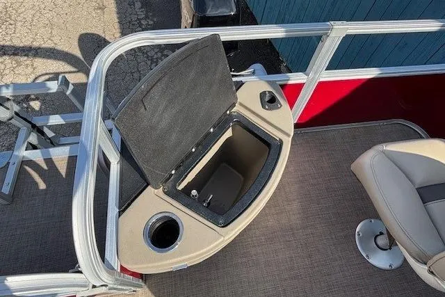 Slide: The Image of 2022 Sun Tracker Bass Buggy 18 DLX boat interior with open storage compartment. - 18