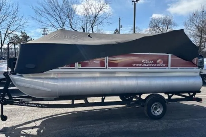 Slide: The Image of 2022 Sun Tracker Bass Buggy 18 DLX pontoon boat with cover on trailer. - 20