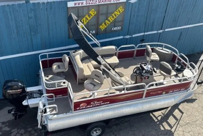 Slide: The Image of 2022 Sun Tracker Bass Buggy 18 DLX pontoon boat with Mercury engine, docked at Sizzle Marine. - 5