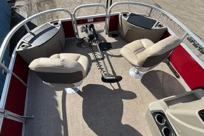 Slide: The Image of 2022 Sun Tracker Bass Buggy 18 DLX interior with seating and fishing equipment. - 6