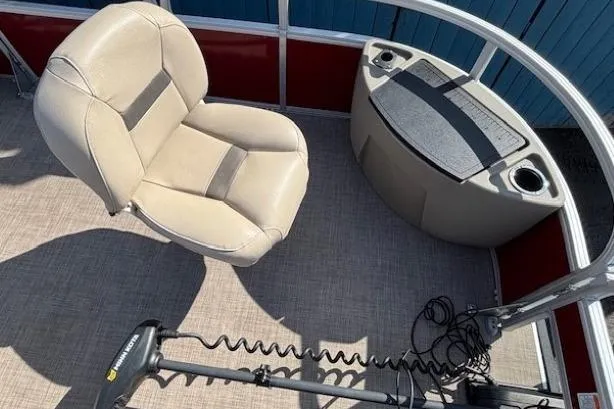 Slide: The Image of 2022 Sun Tracker Bass Buggy 18 DLX interior with beige seat and control panel. - 9