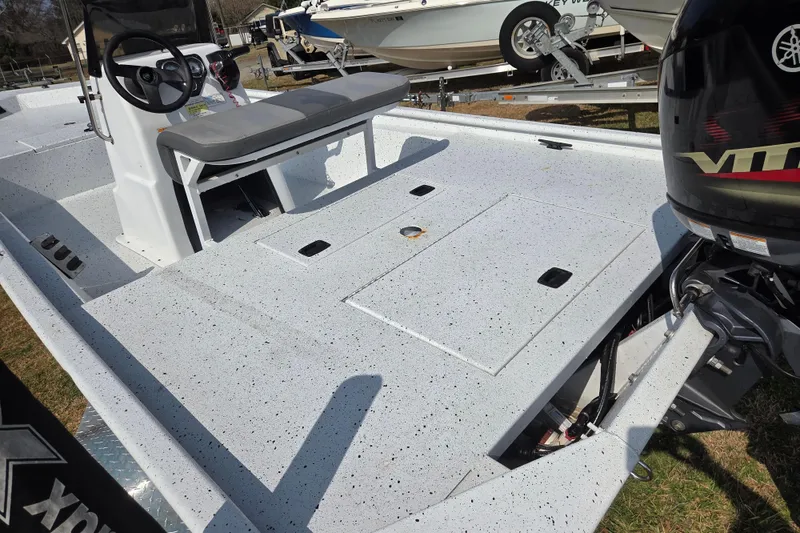 Slide: The Image of 2020 Xpress XP18CC boat with Yamaha engine, featuring spacious deck and seating. - 12