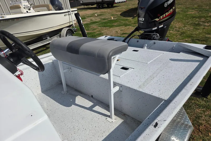 Slide: The Image of 2020 Xpress XP18CC boat interior with steering wheel and Yamaha outboard motor. - 9