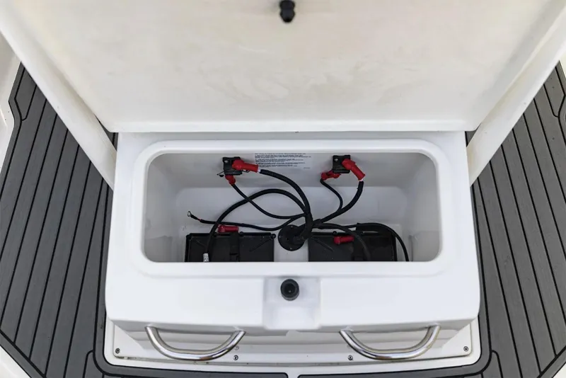 Slide: The Image of Manufacturer Provided Image: 2025 Bayliner Trophy T22CC boat battery compartment with wiring and connections. - 8
