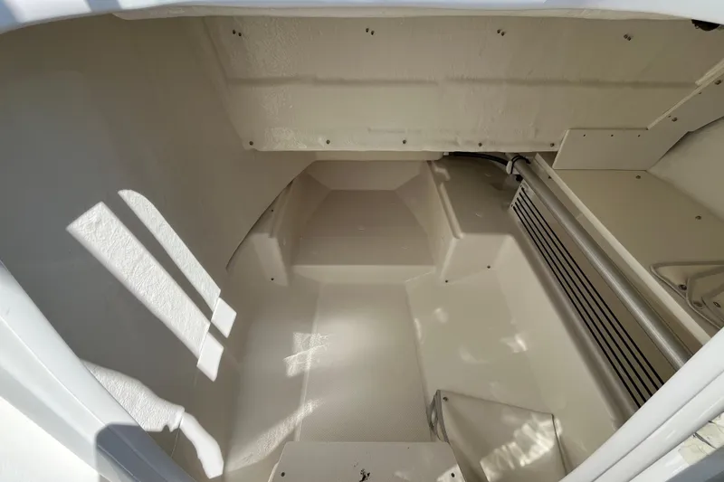 Slide: The Image of 2026 Bayliner Trophy T22SC interior storage compartment, featuring spacious and clean design. - 6