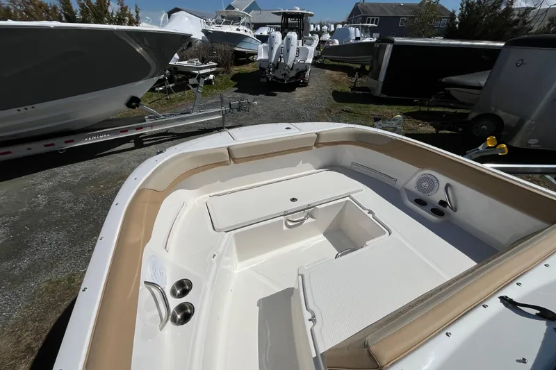 Slide: The Image of 2026 Bayliner Trophy T22SC boat interior with seating and storage compartments. - 7