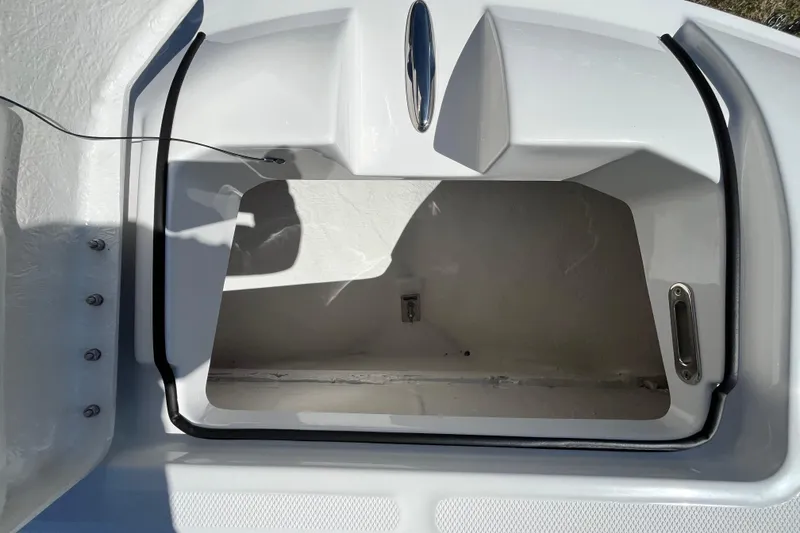 Slide: The Image of Open storage compartment on 2026 Bayliner Trophy T22SC boat, showcasing interior space. - 9