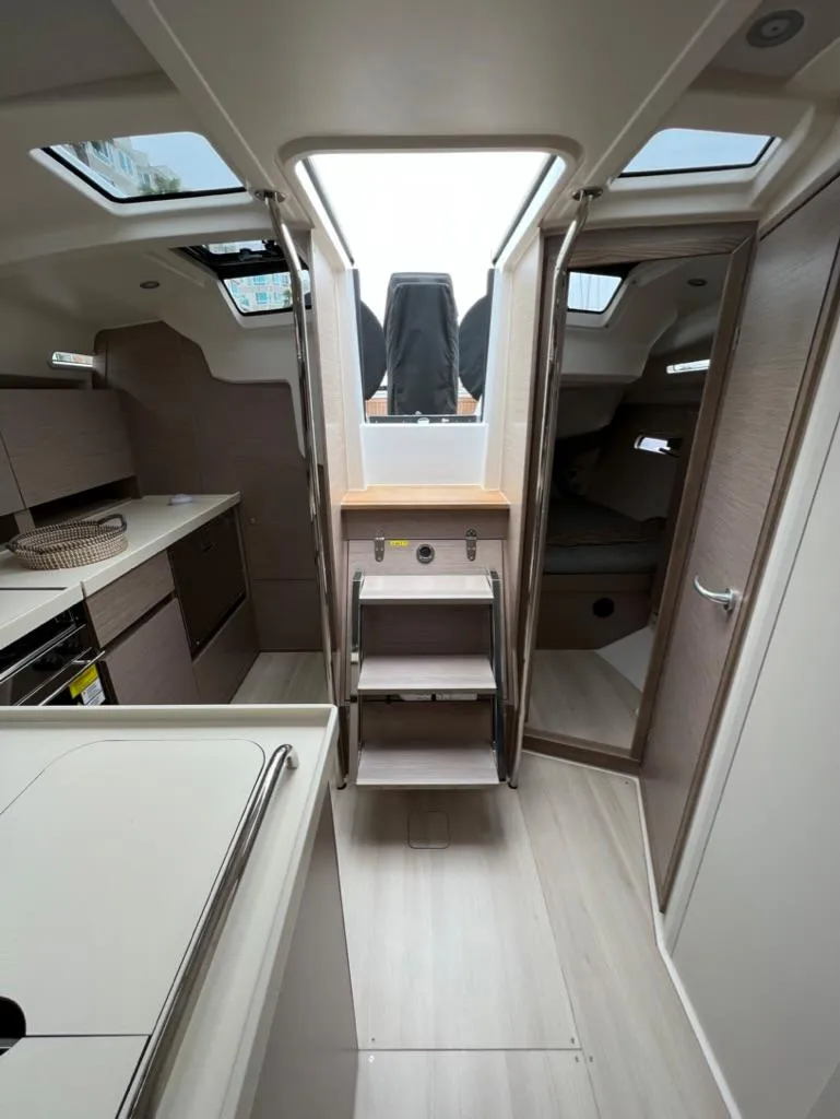 Slide: The Image of Interior of 2023 Hanse 388 sailboat with modern kitchen and cozy cabin. - 14