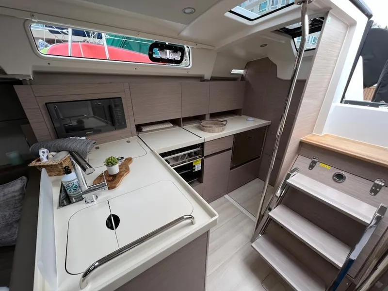 Slide: The Image of Modern kitchen area in 2023 Hanse 388 yacht with sleek cabinetry and appliances. - 13