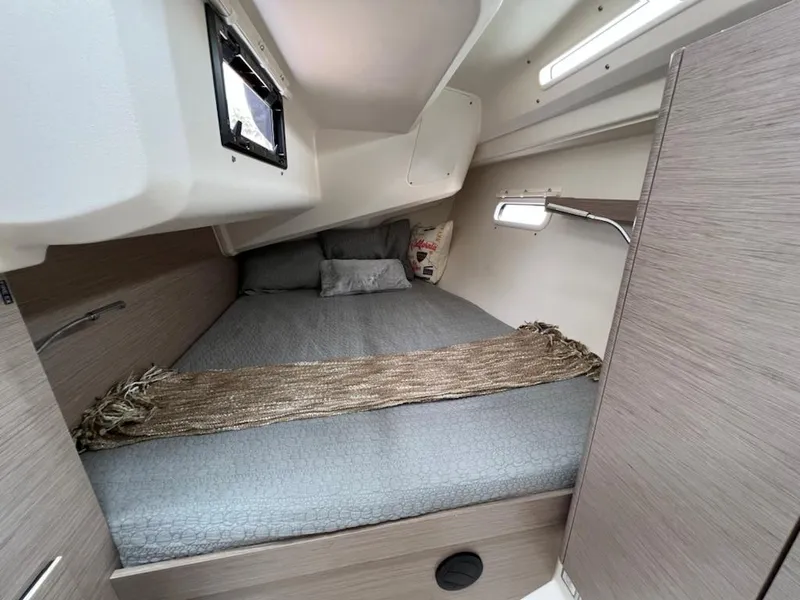 Slide: The Image of Cozy cabin interior of 2023 Hanse 388 sailboat with bed and reading light. - 28
