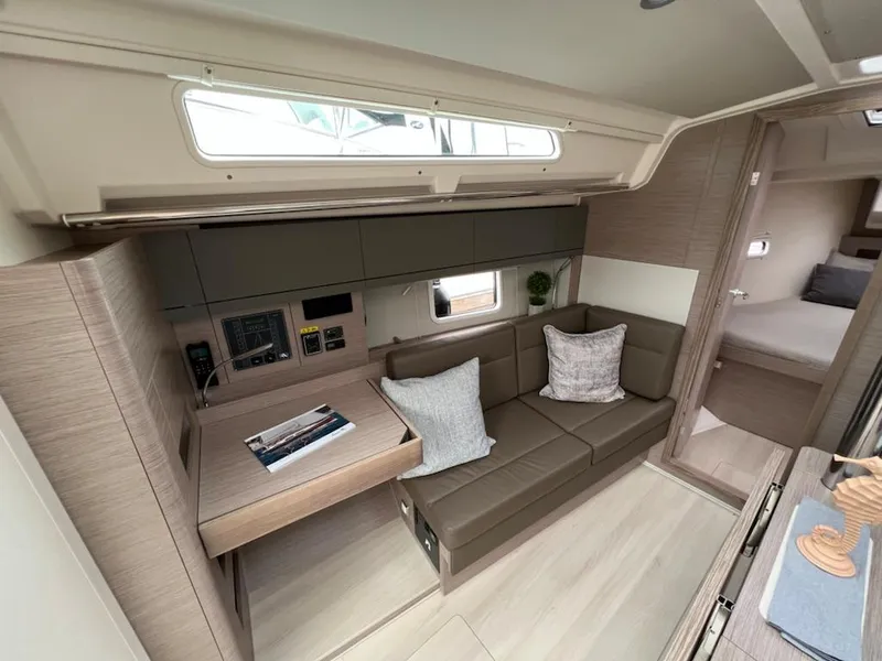 Slide: The Image of Modern interior of 2023 Hanse 388 yacht with cozy seating and navigation station. - 16