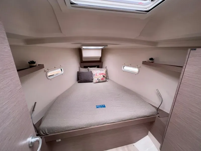 Slide: The Image of 2023 Hanse 388 yacht interior cabin with bed and skylight. - 21