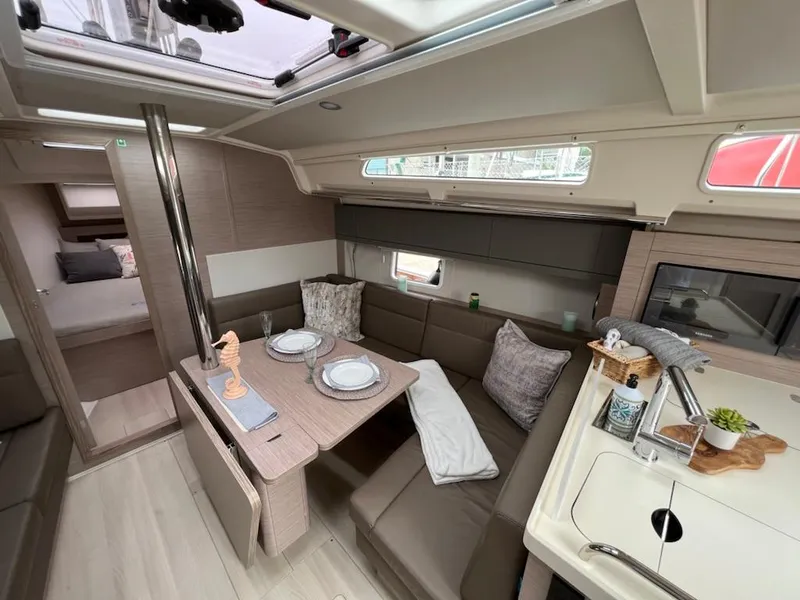 Slide: The Image of Modern interior of 2023 Hanse 388 yacht with dining area and kitchenette. - 17