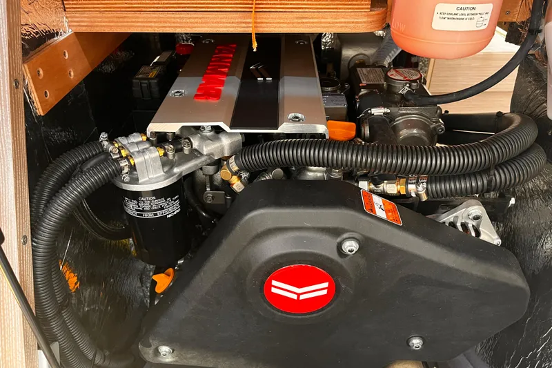 Slide: The Image of Engine compartment of a 2023 Hanse 388 yacht, showcasing detailed mechanical components. - 37