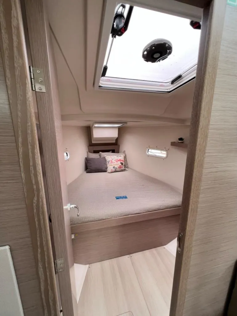 Slide: The Image of Interior cabin of 2023 Hanse 388 sailboat with skylight and cozy bed. - 25