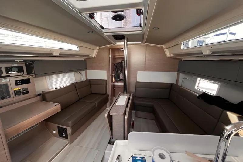 Slide: The Image of 2023 Hanse 388 yacht interior with modern seating and sleek design. - 20