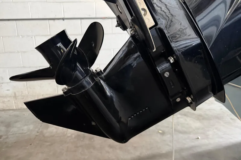 Slide: The Image of Close-up of 2023 Boston Whaler 130 Super Sport boat propeller in a garage. - 9