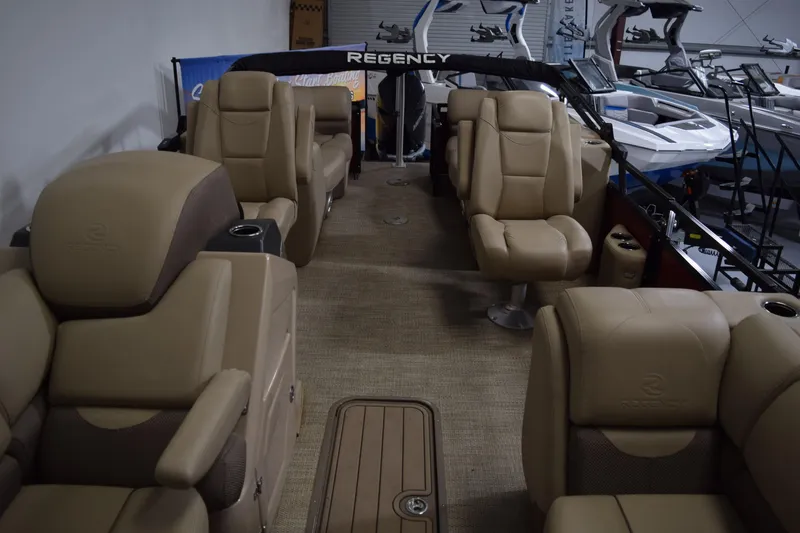 Slide: The Image of Luxurious interior of 2022 Regency 230 DL3 pontoon boat with plush seating. - 12
