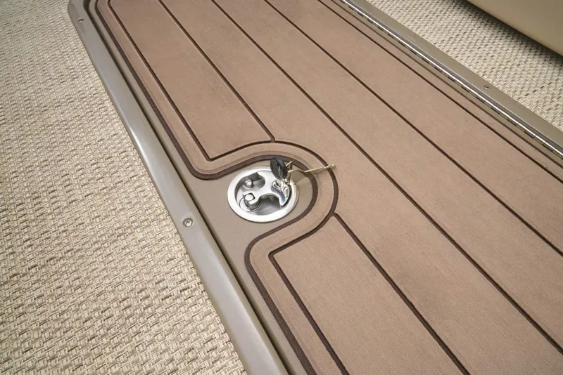 Slide: The Image of Regency 230 DL3 2022 boat deck with carpet and fuel cap. - 31