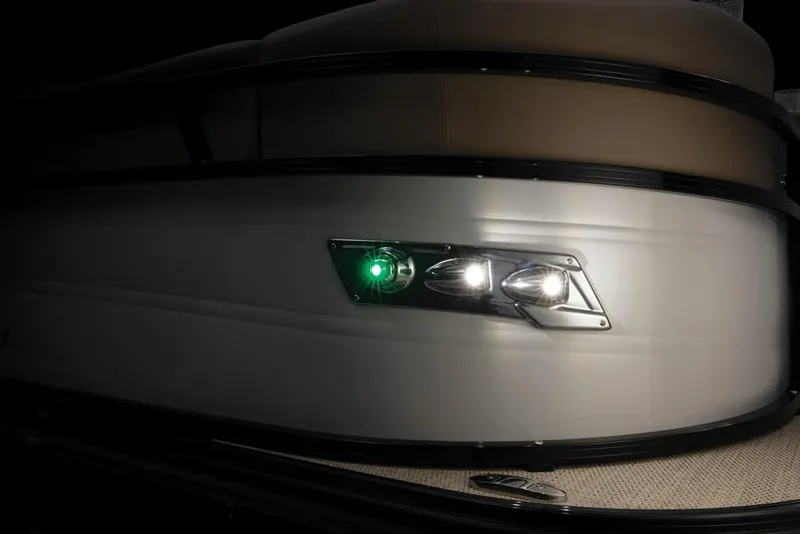 Slide: The Image of Regency 230 DL3 2022 boat with navigation lights at night. - 48