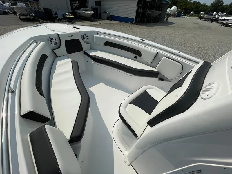 Slide: The Image of 2025 Tidewater 232 CC Adventure boat interior with sleek seating and modern design. - 10