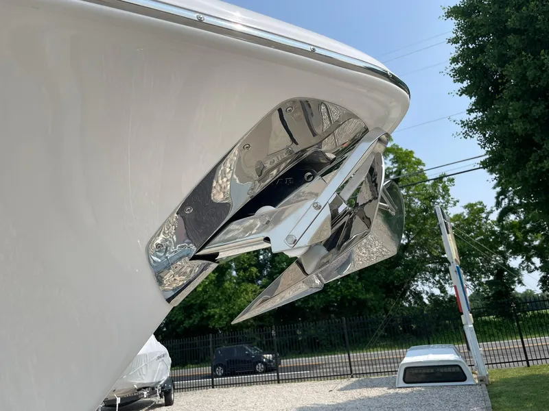 Slide: The Image of 2025 Tidewater 232 CC Adventure boat anchor detail with chrome finish, outdoors. - 2