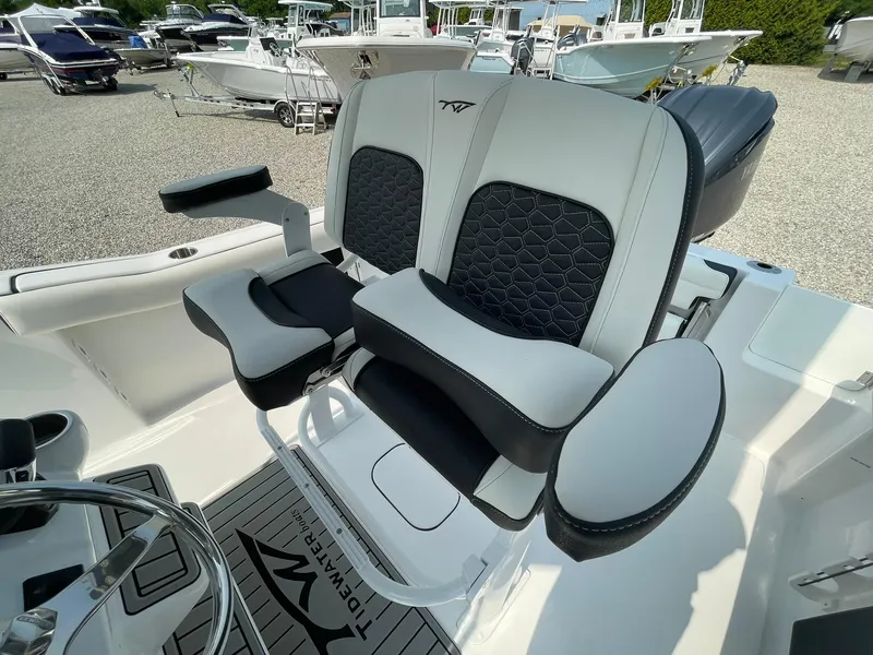 Slide: The Image of 2025 Tidewater 232 CC Adventure boat seats with modern design and comfortable padding. - 28