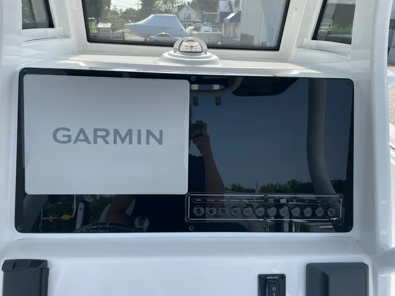 Slide: The Image of 2025 Tidewater 232 CC Adventure boat dashboard with Garmin navigation system. - 30
