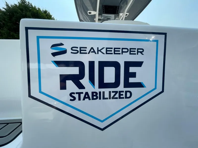 Slide: The Image of Tidewater 232 CC Adventure 2025 with Seakeeper Ride Stabilized logo. - 32